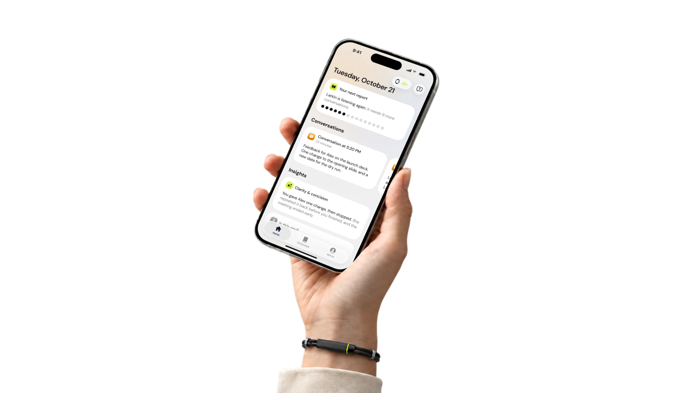 A hand holding a phone open on the Larkin app's Home screen, the Larkin band on the wrist